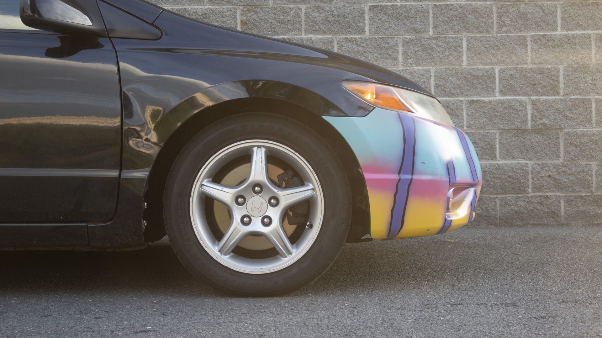 Honda Civic coupe, front wheel detail.