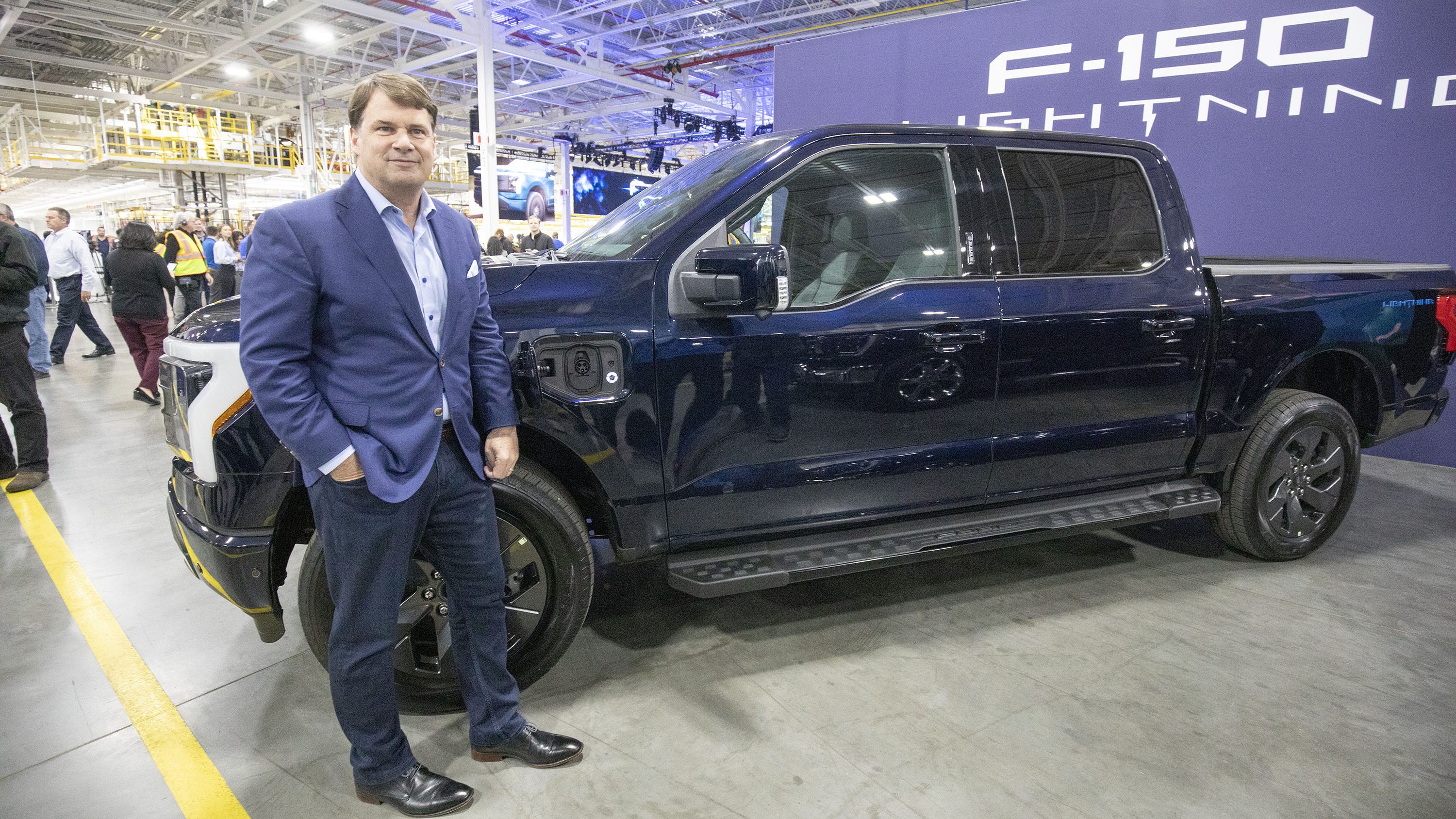 DEARBORN, MI - APRIL 26: Ford CEO Jim Farley poses for a photo with an all-electric F-150 Lightning pickup truck during the vehicle's launch at the Ford Rouge Electric Vehicle Center on April 26, 2022 in Dearborn, Michigan. The F-150 Lightning is positioned to be the first full-size all-electric pickup truck to go on sale in the mainstream U.S. market. (Photo by Bill Pugliano/Getty Images)