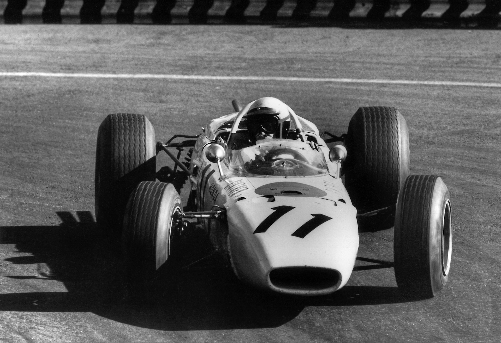 Richie Ginther, Honda RA272, Grand Prix of Mexico, Autodromo Hermanos Rodriguez, Magdalena Mixhuca, 24 October 1965. Richie Ginther driving his Honda RA272 to a historic victory (first victory for Ginther, Honda and Goodyear) in the 1965 Mexican Grand Prix. (Photo by Bernard Cahier/Getty Images)