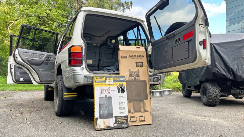 Husky Liners floor mats and Cargo Logic trunk liner in an old Mitsubishi Montero.