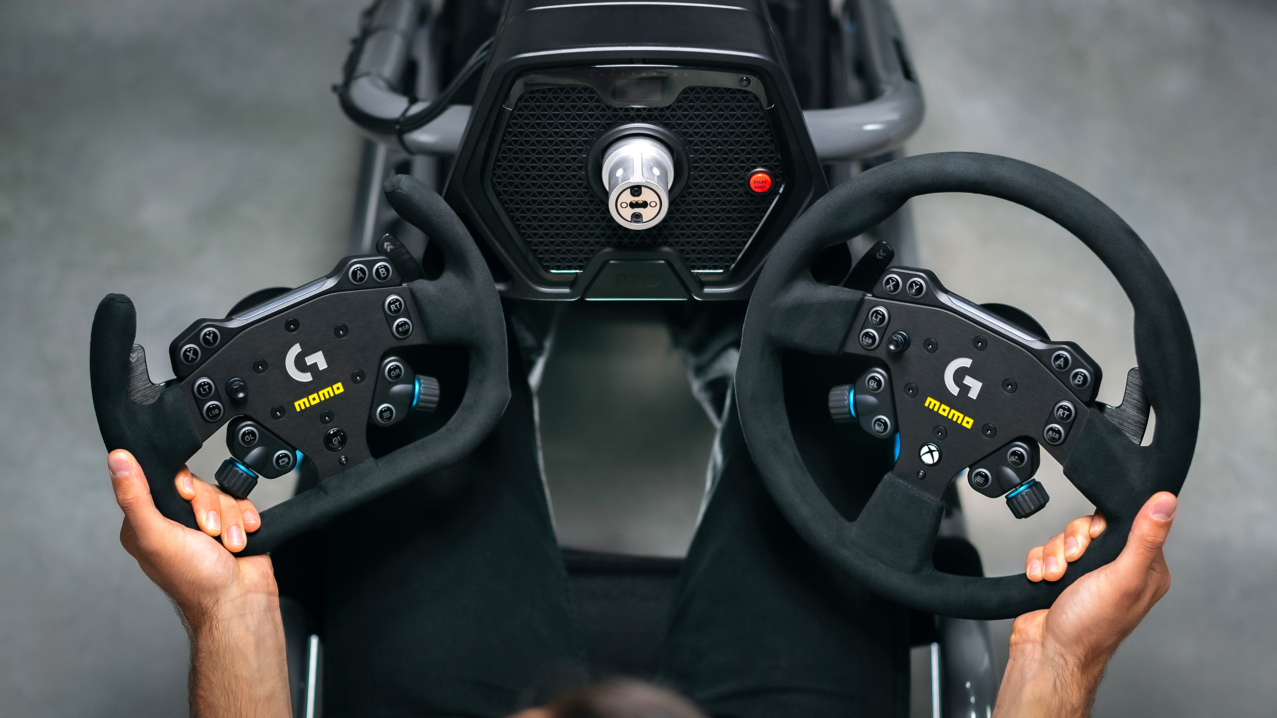 Momo Logitech sim racing steering wheels and Logitech G Pro base.