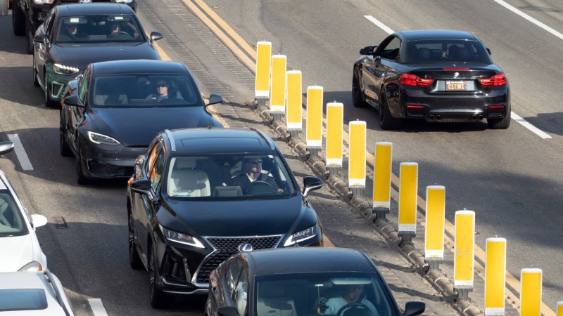 BMW sneaks out of PCH traffic.