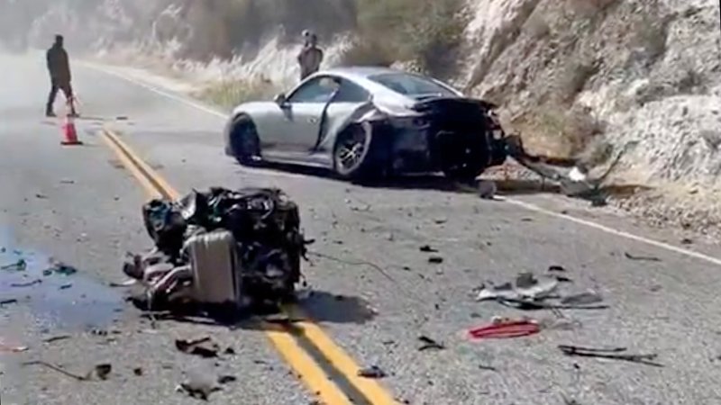 A wrecked Porsche 911 sits on Angeles Forest Highway with its engine ripped out from a crash.