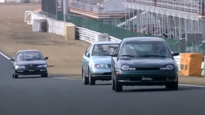 Chrysler Neon, Nissan Sunny, and Honda Accord race at Tsukuba in a screenshot of a Best Motoring episode.