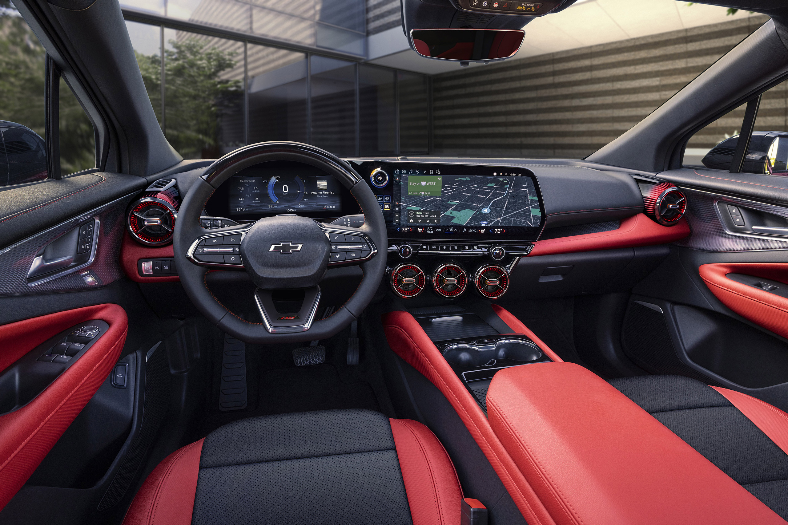 Wide view of front cabin in 2024 Chevrolet Blazer EV SS with Adrenaline Red and Blacken Black interior and Adrenaline Red accents. Preproduction model shown.