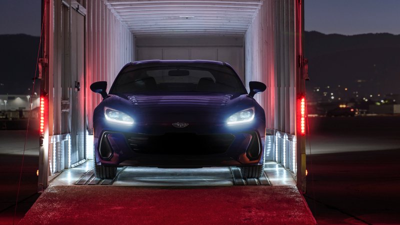 Front of Subaru BRZ Series.Purple seen in car trailer at night.