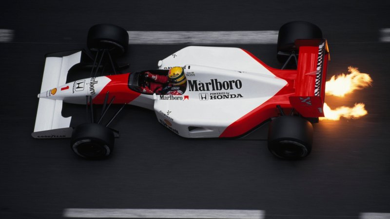 Flames shoot out from under the Formula One racecar of driver Ayrton Senna, of the McLaren-Honda racing team, during the 1991 Monaco Grand Prix. (Photo by Patrick Behar/Corbis via Getty Images)