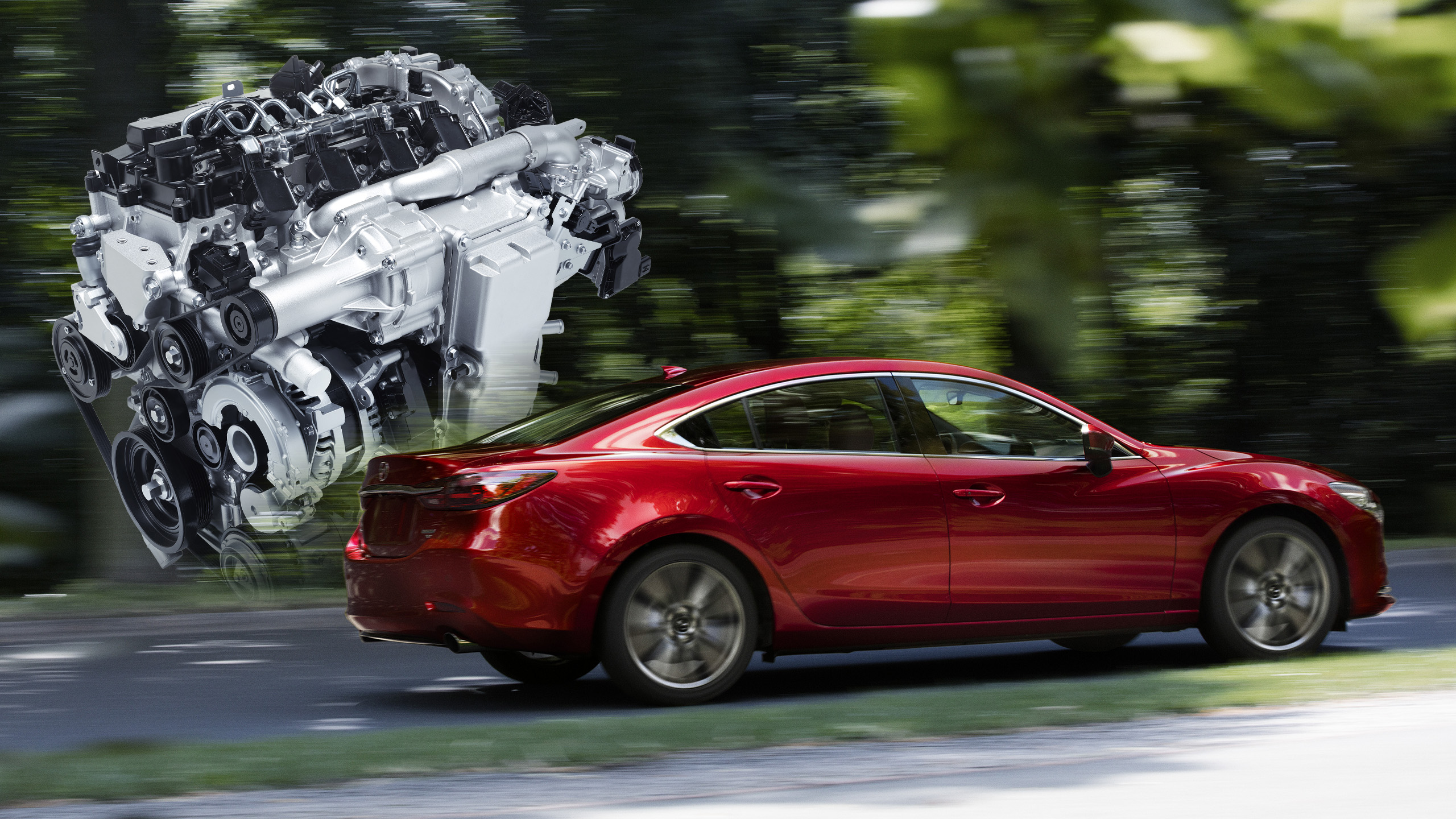 A Mazda Skyactiv-X engine behind a Mazda6 driving through a forest. The new Skyactiv-Z will replace the Skyactiv-X and Skyactiv-G.