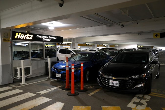 SAN FRANCISCO, CALIFORNIA - APRIL 30: Car sit idle at the Hertz Rent-A-Car rental lot at San Francisco International Airport on April 30, 2020 in San Francisco, California. According to a report in the Wall Street Journal, car rental company Hertz is preparing to file for bankruptcy as the travel industry has come to a standstill due to the coronavirus (COVID-19) pandemic. (Photo by Justin Sullivan/Getty Images)