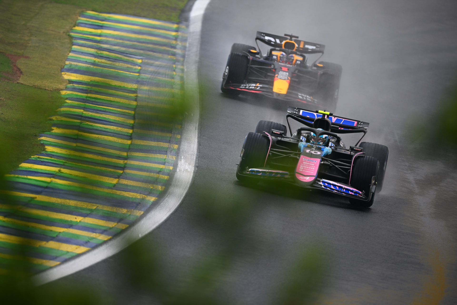 SAO PAULO, BRAZIL - NOVEMBER 03: Pierre Gasly of France driving the (10) Alpine F1 A524 Renault leads Max Verstappen of the Netherlands driving the (1) Oracle Red Bull Racing RB20 on track during qualifying ahead of the F1 Grand Prix of Brazil at Autodromo Jose Carlos Pace on November 03, 2024 in Sao Paulo, Brazil. (Photo by Clive Mason/Getty Images)