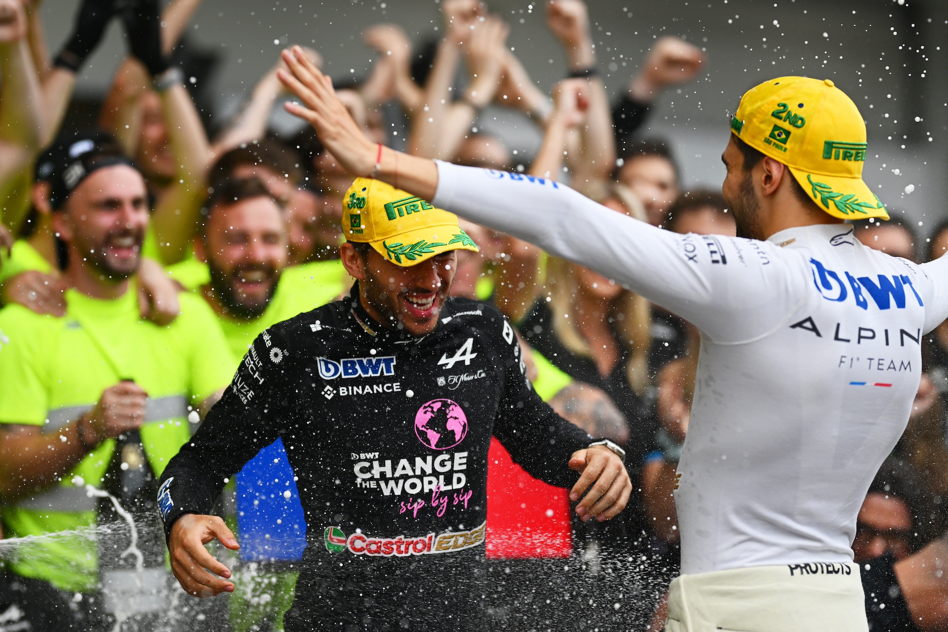 SAO PAULO, BRAZIL - NOVEMBER 03: Second placed Esteban Ocon of France and Alpine F1 and Third placed Pierre Gasly of France and Alpine F1 celebrate with their team after the F1 Grand Prix of Brazil at Autodromo Jose Carlos Pace on November 03, 2024 in Sao Paulo, Brazil. (Photo by Clive Mason/Getty Images)