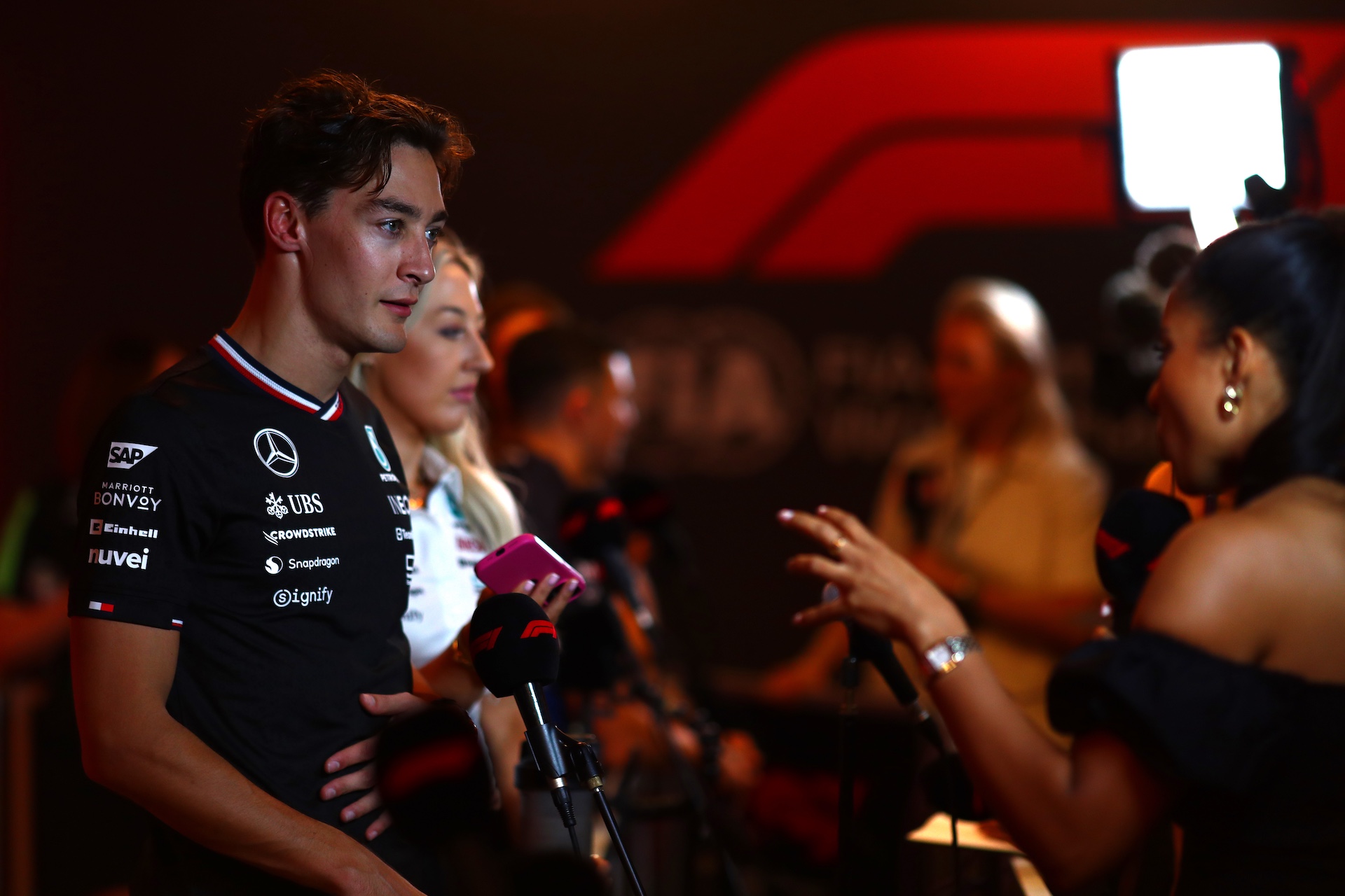 ABU DHABI, UNITED ARAB EMIRATES - DECEMBER 06: George Russell of Great Britain and Mercedes talks to the media in the Paddock after practice ahead of the F1 Grand Prix of Abu Dhabi at Yas Marina Circuit on December 06, 2024 in Abu Dhabi, United Arab Emirates. (Photo by Peter Fox - Formula 1/Formula 1 via Getty Images)