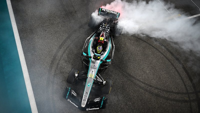 ABU DHABI, UNITED ARAB EMIRATES - DECEMBER 08: 4th placed Lewis Hamilton of Great Britain driving the (44) Mercedes AMG Petronas F1 Team W15 does donuts on track to celebrate his final race with Mercedes during the F1 Grand Prix of Abu Dhabi at Yas Marina Circuit on December 08, 2024 in Abu Dhabi, United Arab Emirates. (Photo by Clive Mason/Getty Images)