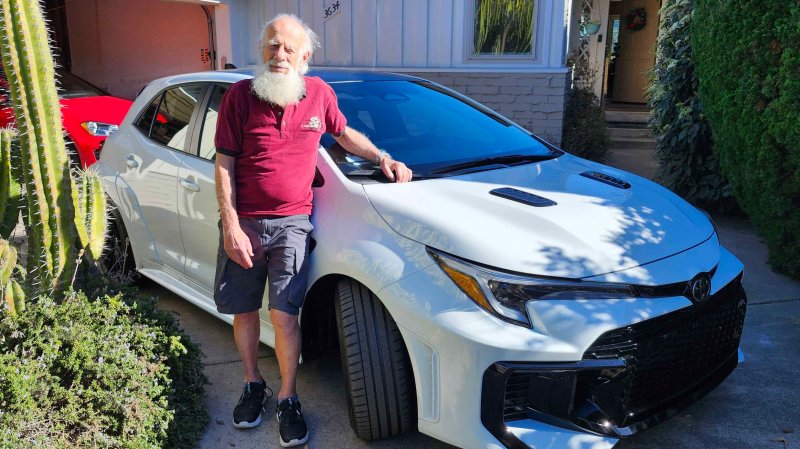 Herb Stern posing with his new 2025 Toyota GR Corolla in Ice White.