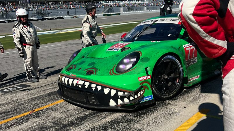 Photo of 'Rexy' Porsche 911 GT3 R race car with a new, clean front bumper in the pits.