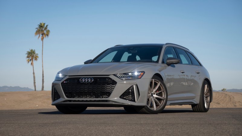 Audi RS 6 in Nardo Gray posted up with palm trees.