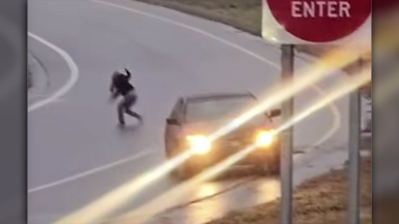 Watch a Panicking Driver Bail Out of Moving Car After Hitting Ice on Offramp