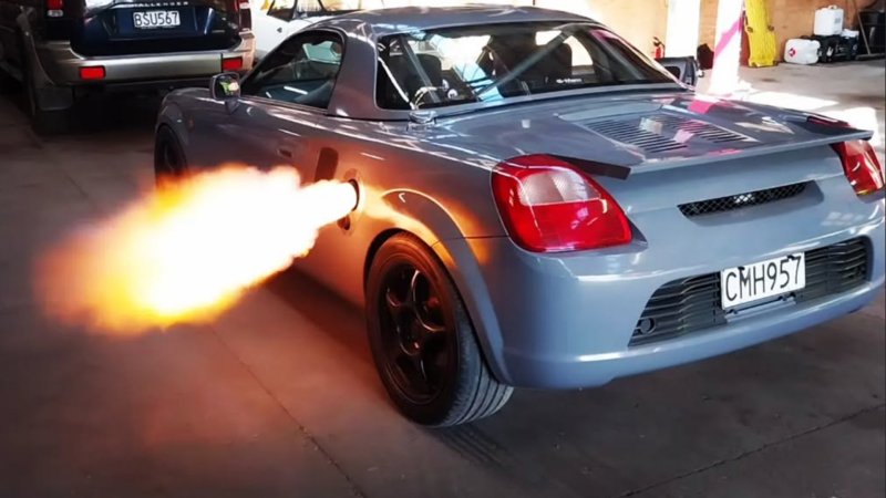 Brad Glasgow's turbo MR2 shooting flames out of its side exhaust.