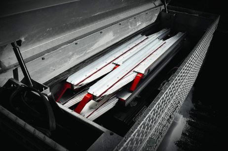 Two ramps folded up in a toolbox. 