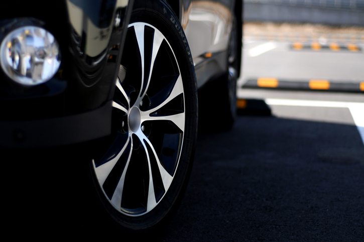 The wheel of a parked vehicle