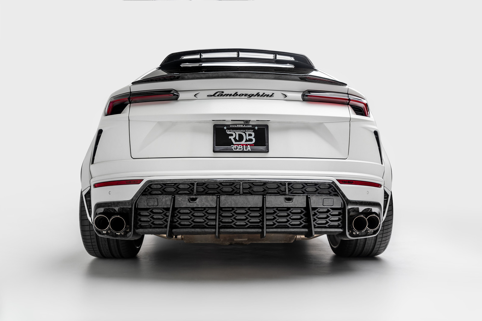 message-editor%2F1580326025372-1016-industries-lamborghini-urus-widebody-white-rear-bumper.jpg