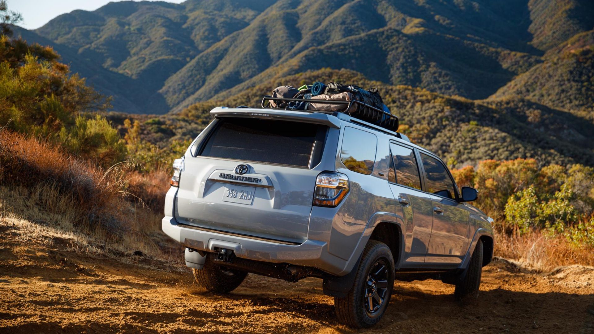 A Toyota 4Runner off-roading to a camp site.