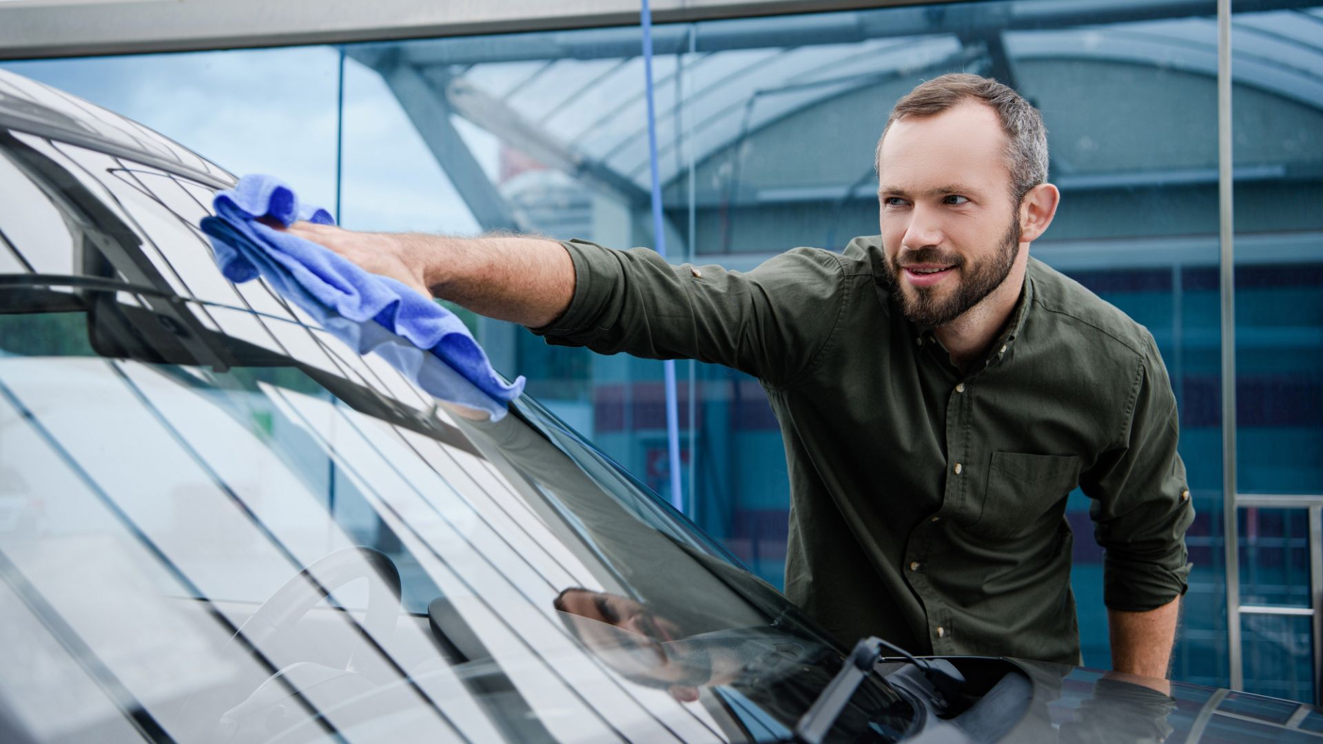 A man holding a microfiber towel.