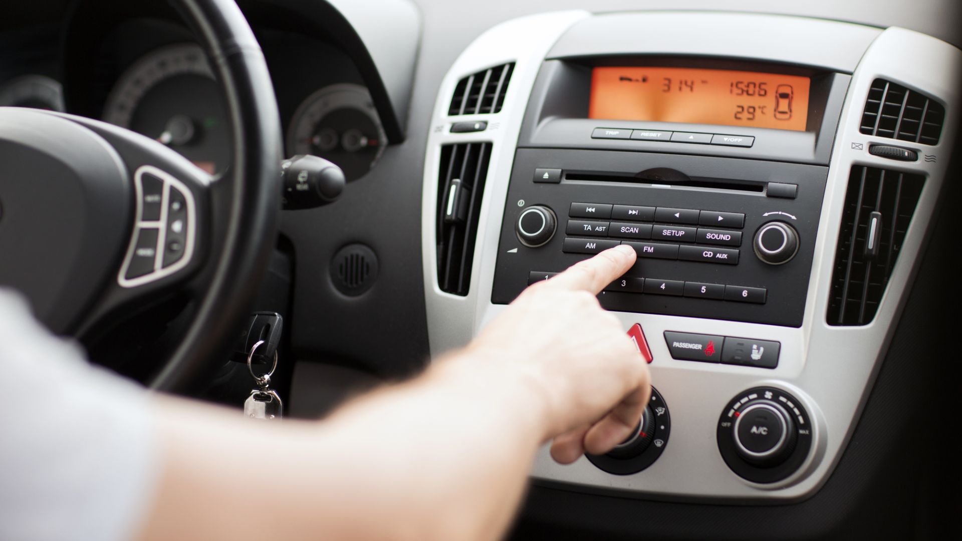 Changing the source on a radio. 