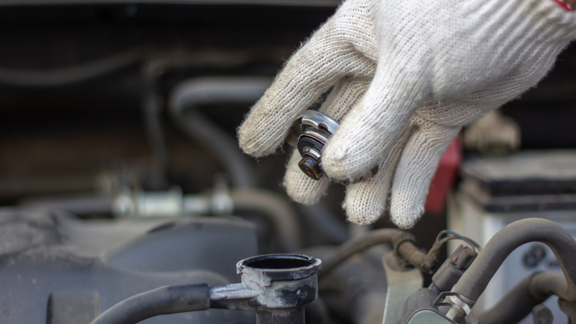 Removing the radiator cap.