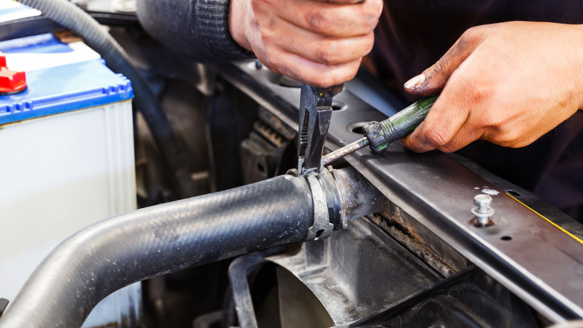 Pulling apart a radiator hose.