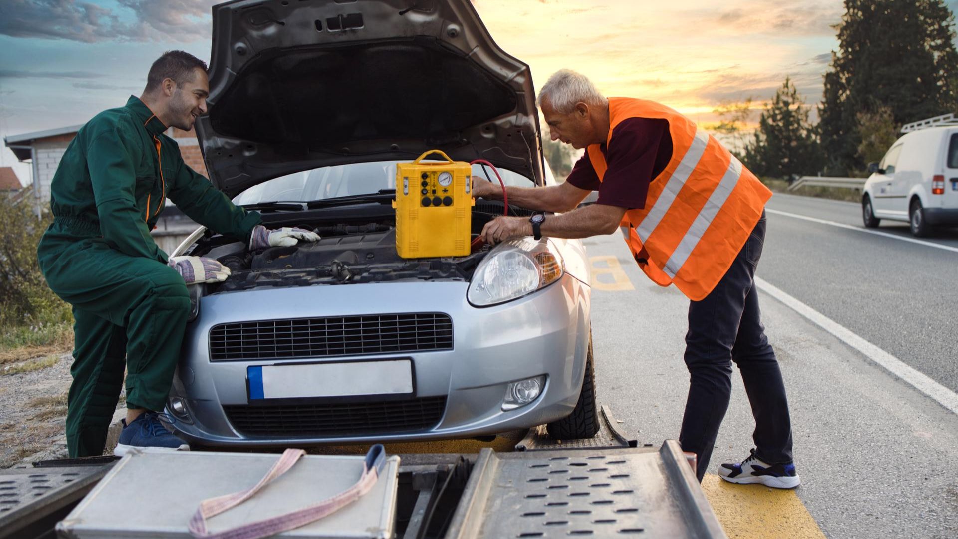 Jump starting a car.