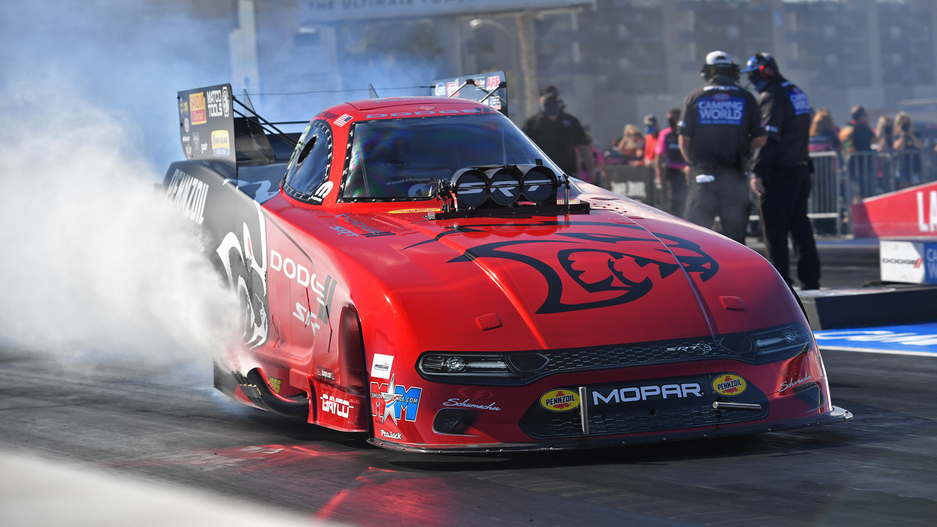 A MOPAR drag racer does a burnout.