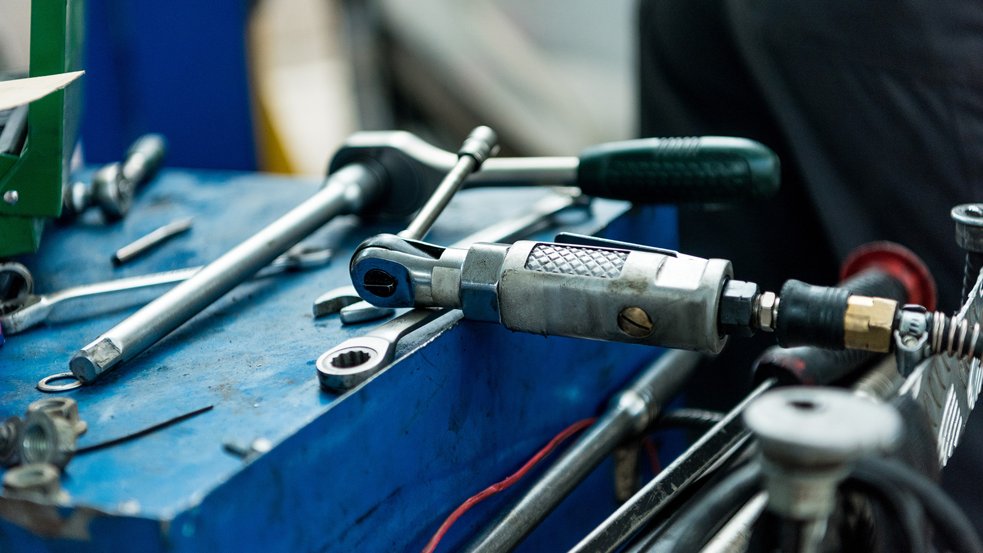 A pneumatic ratchet  on a toolbox.