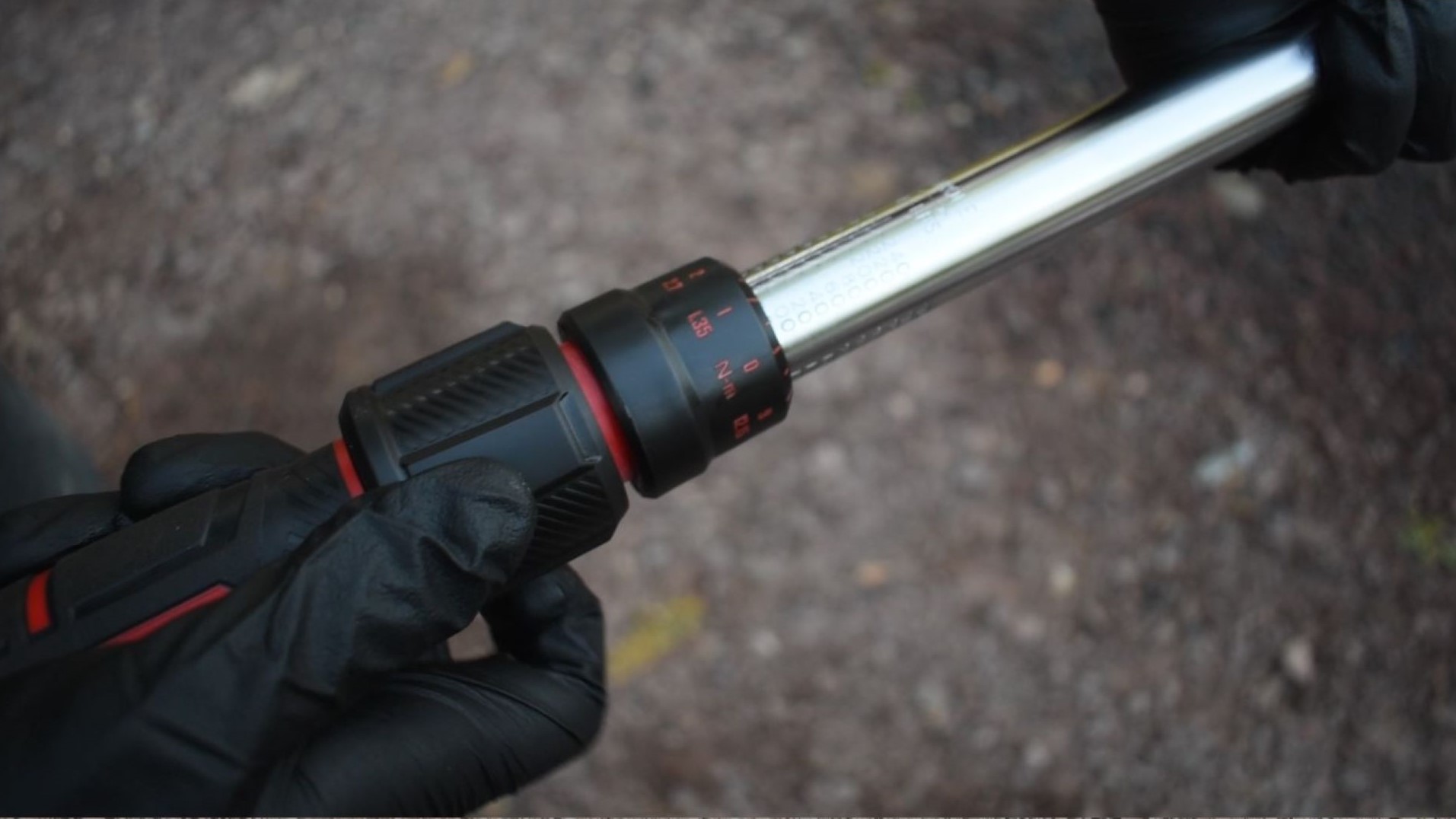 Examining the torque wrench's collar.