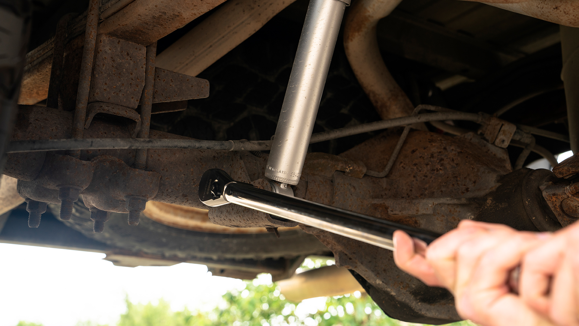 Tightening down a suspension bolt. 