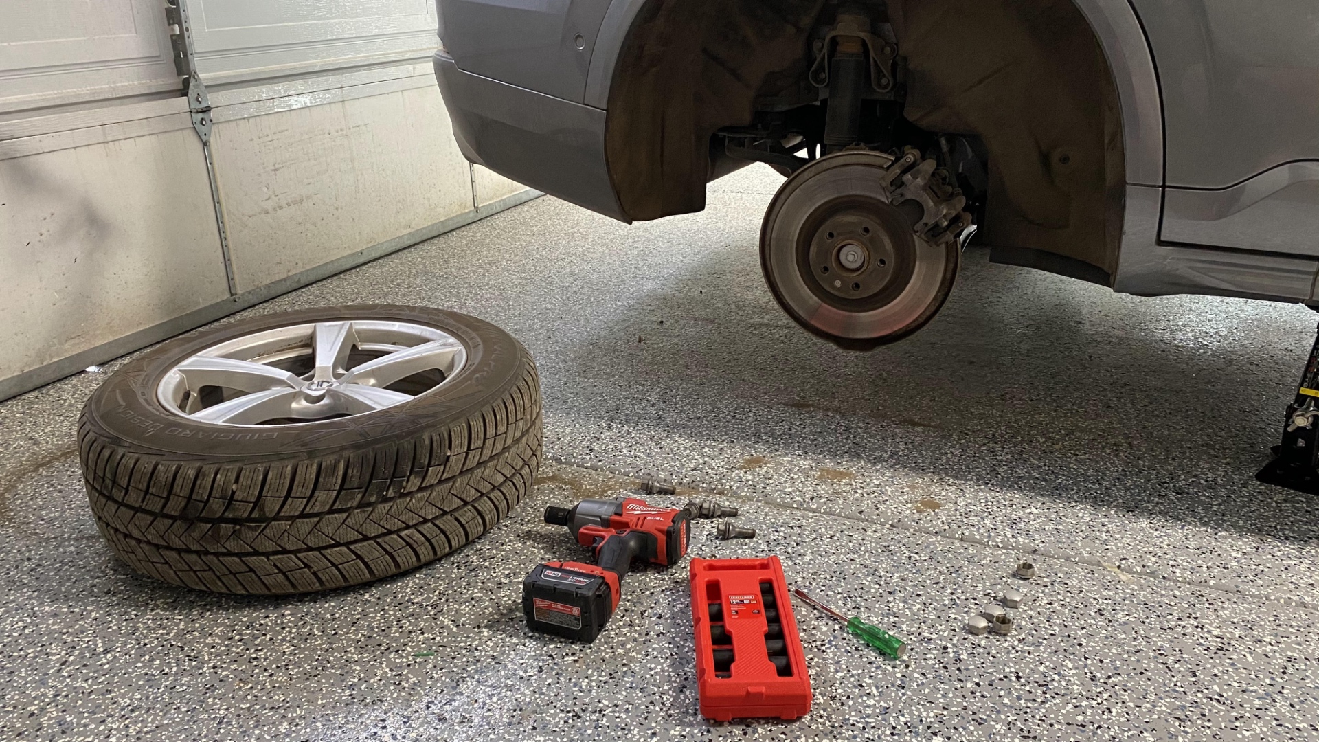 Rotating the Volvo's tires.