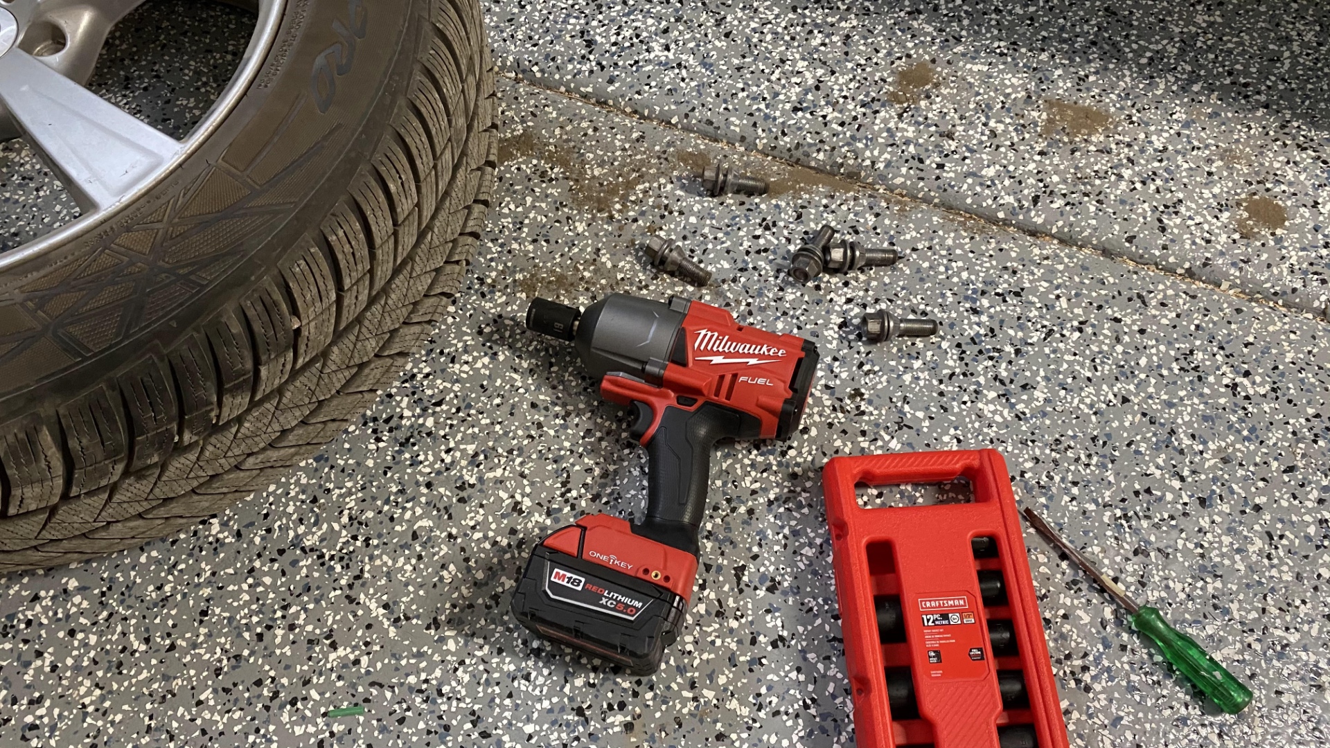 The Milwaukee, lugs, tire, and sockets.