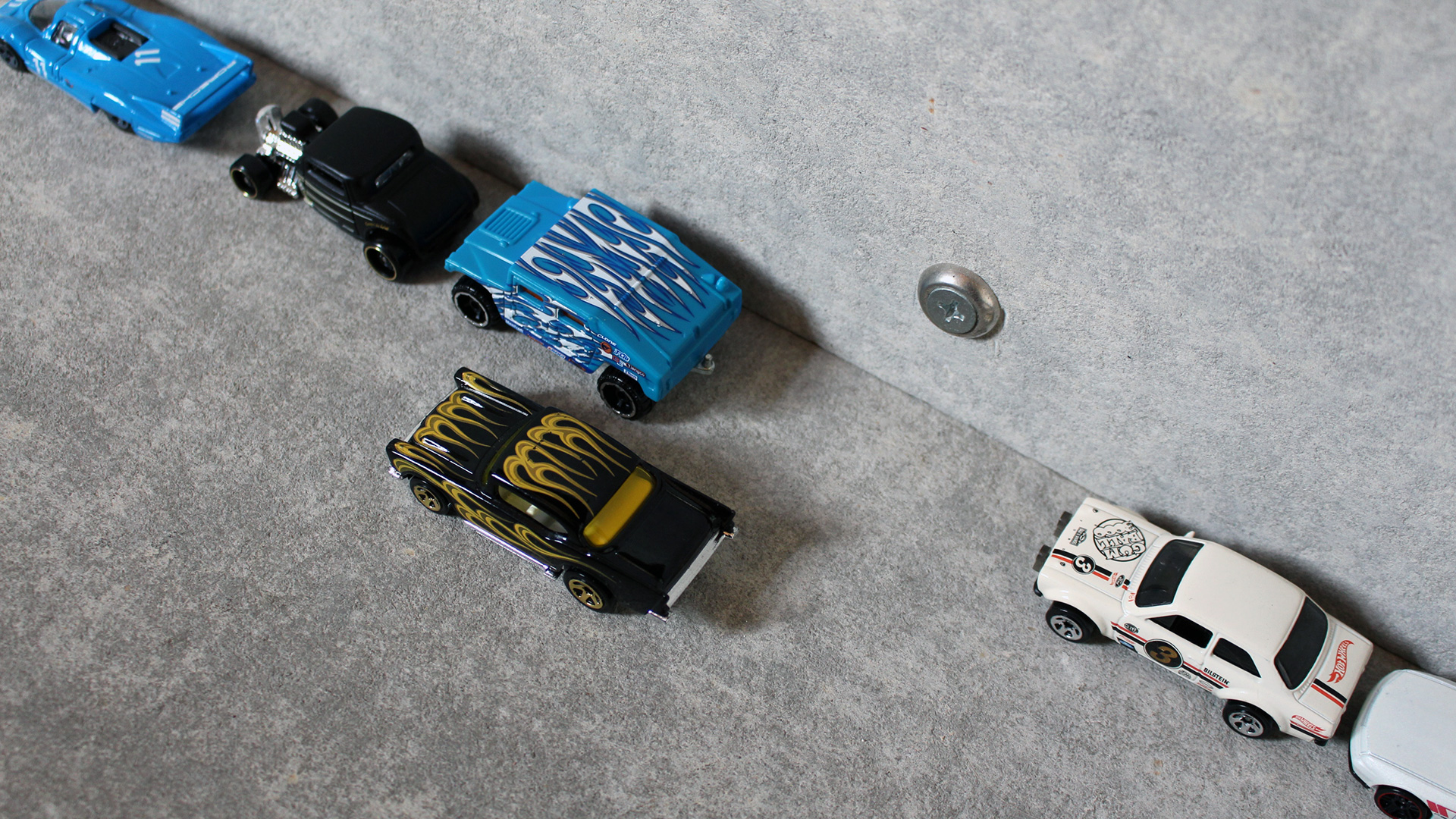 A demonstration of parallel parking using Hot Wheels cars.