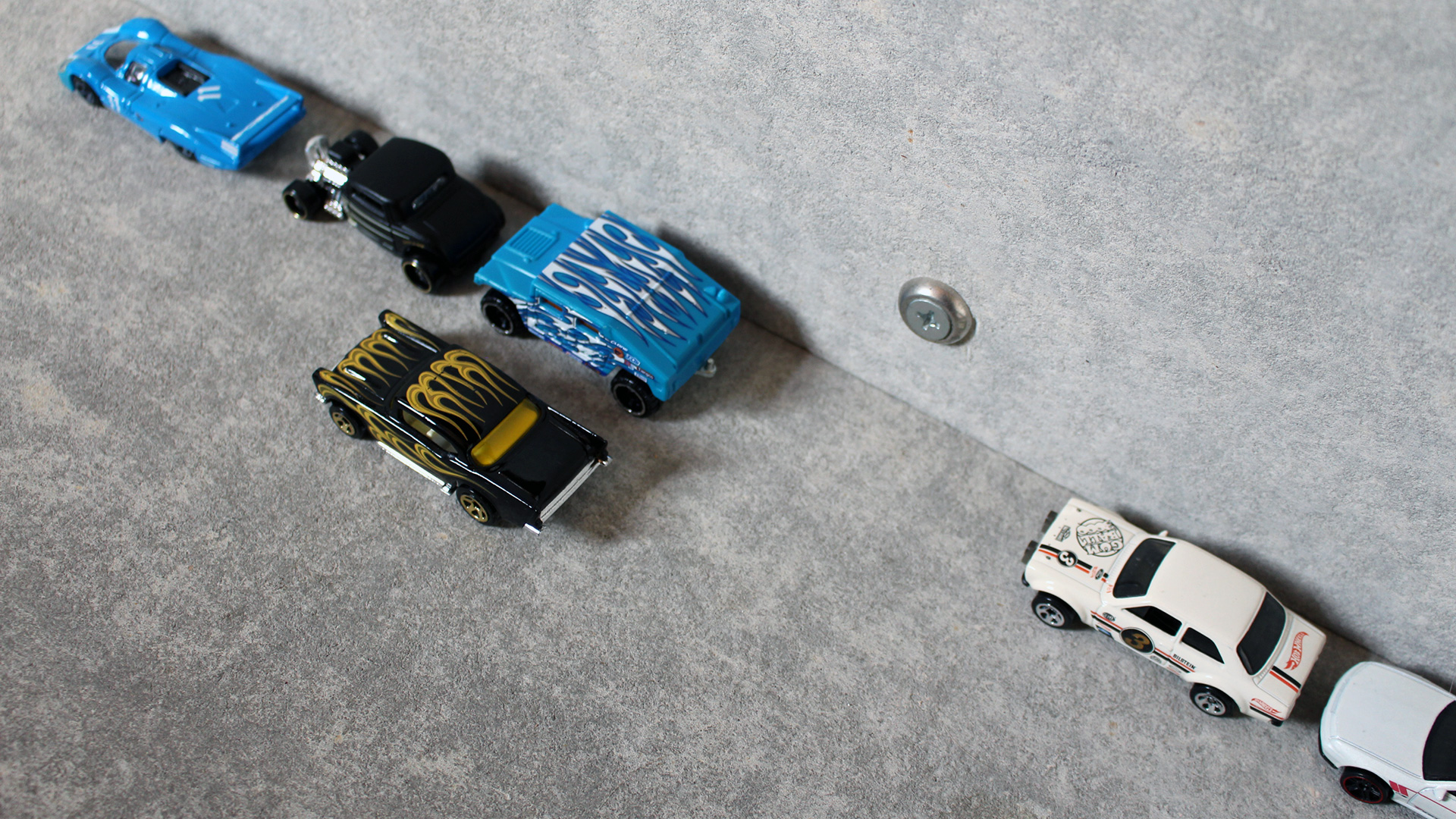 A demonstration of parallel parking using Hot Wheels cars.