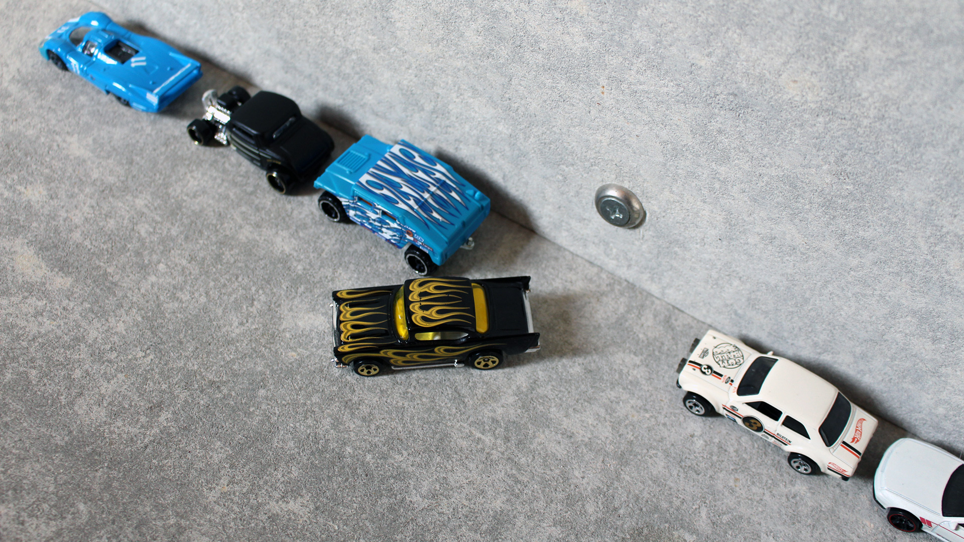 A demonstration of parallel parking using Hot Wheels cars.