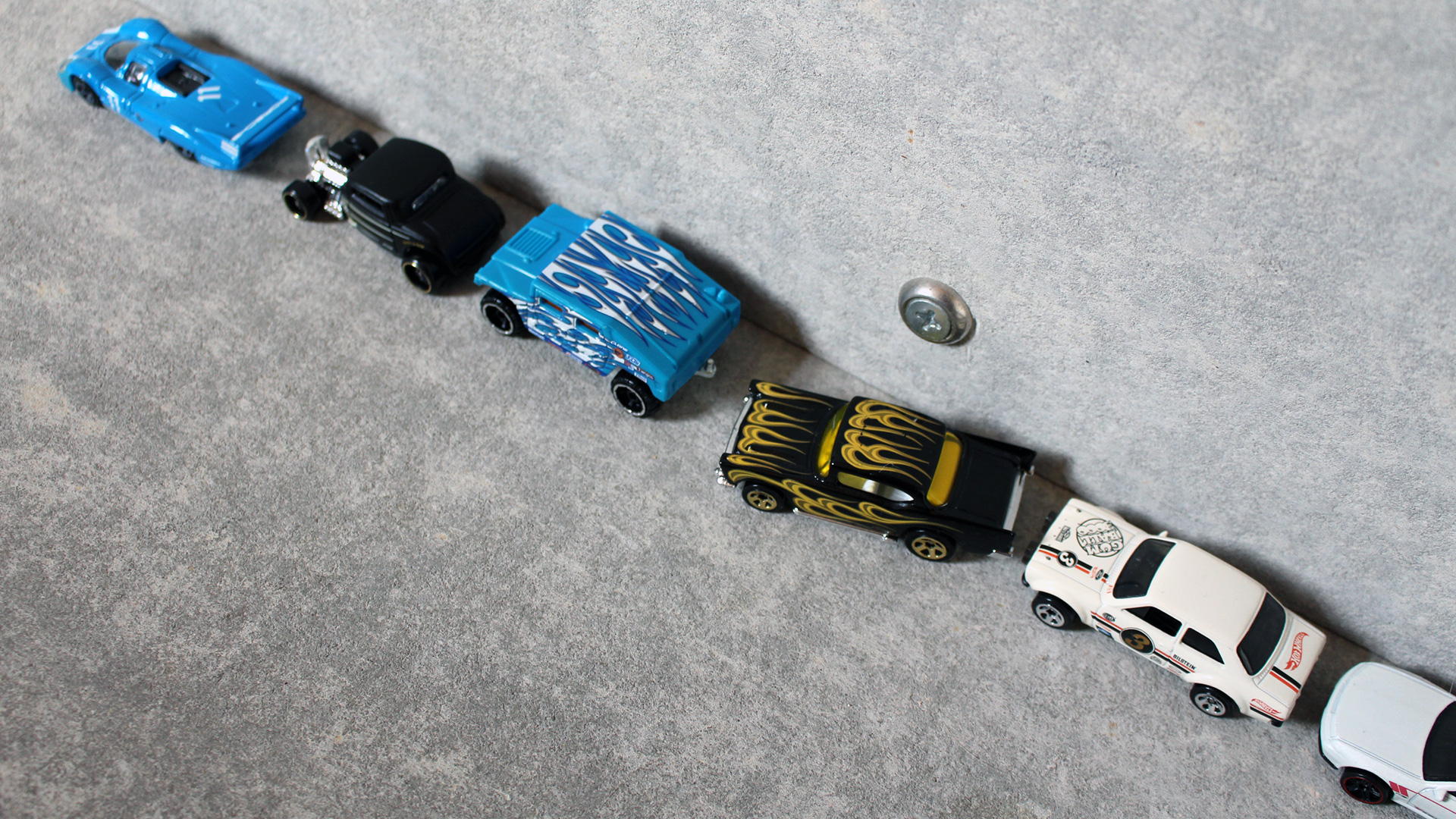 A demonstration of parallel parking using Hot Wheels cars.