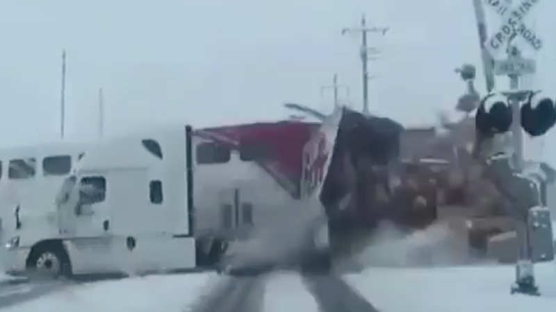 Dash Cam Video Captures Commuter Train Ramming FedEx Truck