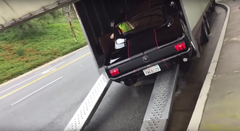 Watch This Classic 1965 Ford Mustang Crash Its Way Onto a Trailer