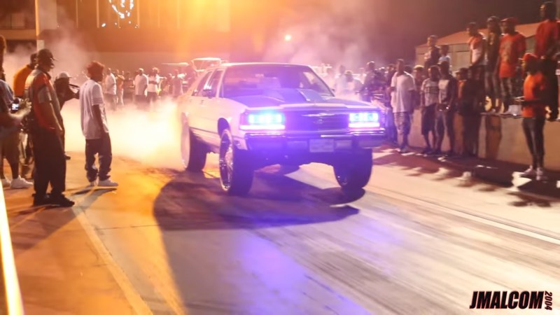 Watch a Lifted Ford Crown Victoria LTD on 30-Inch Rims Hit the Drag Strip
