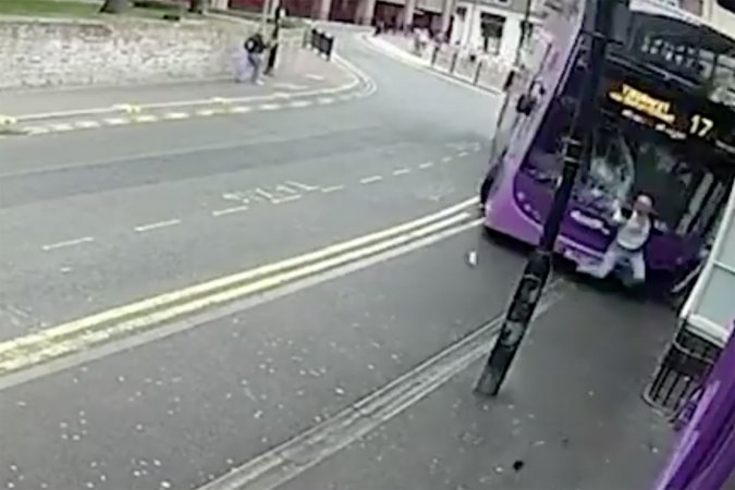 Watch This Pedestrian Get Blasted by a Bus and Walk Away