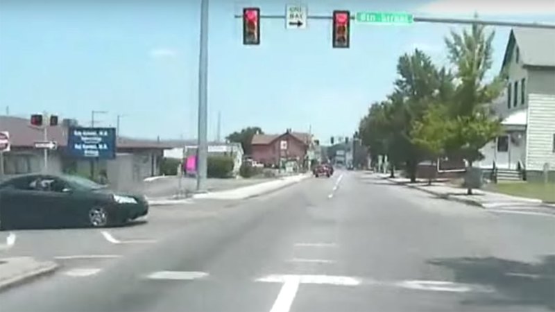 Watch a Police Cruiser Get T-Boned After Blowing Through a Red Light