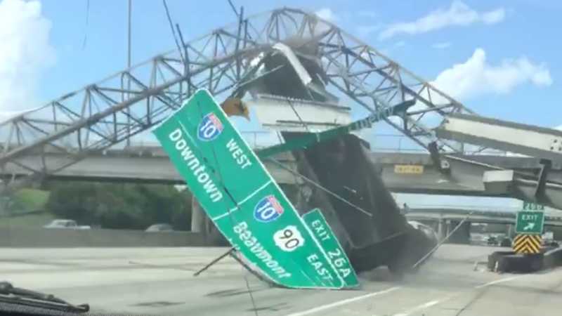 Watch This Dump Truck Flip After Smashing Highway Sign With Raised Bed