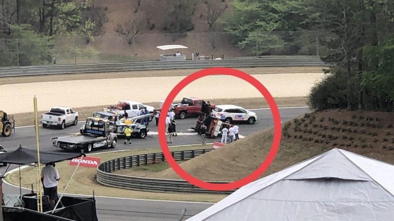 Watch This Daring Race Track Worker Take a Corner Too Fast, Flip a Sweeper on Its Side