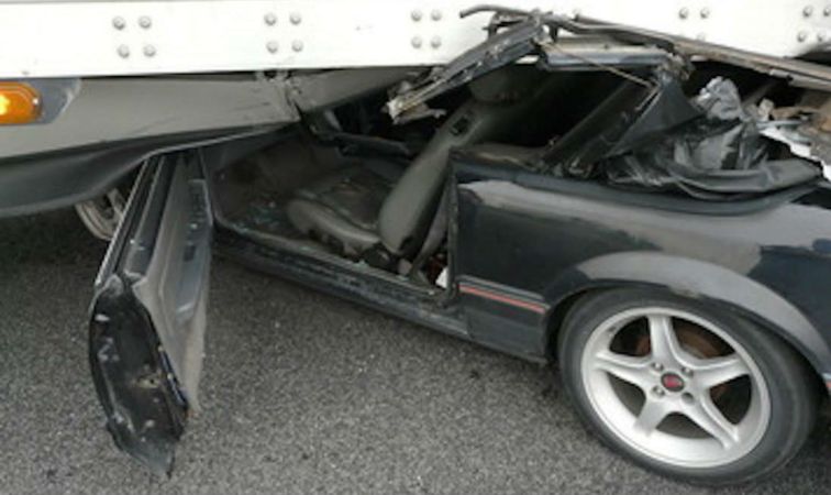 Semi Truck Driver Drags Crushed Ford Mustang for Half-Mile Before Realizing Something’s Wrong