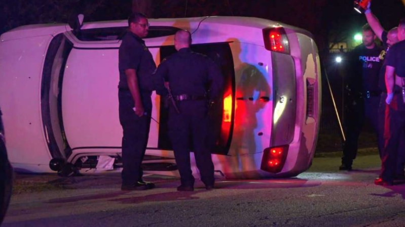 Police Car Flips Over, Catches Fire After Hitting Giant Pothole on Houston Streets